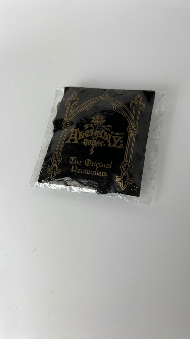 Black Eretica choker with pearlescent button and skull and crossbones detail