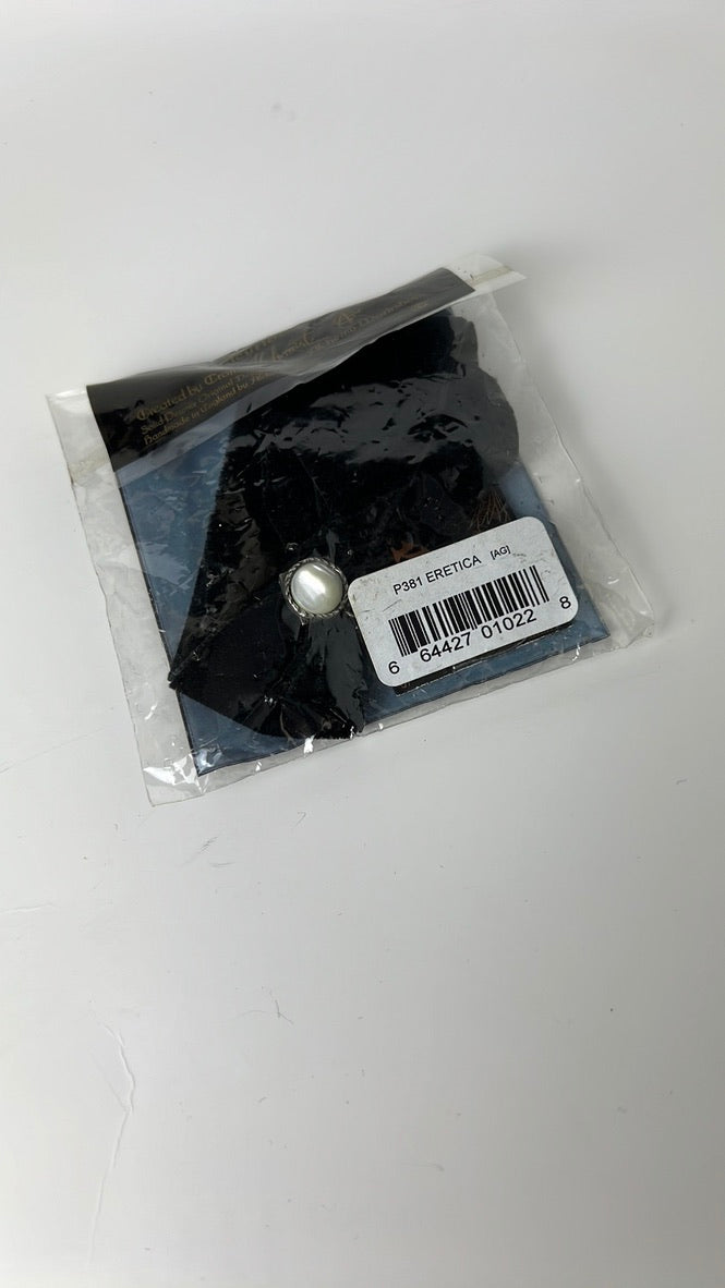 Black Eretica choker with pearlescent button and skull and crossbones detail